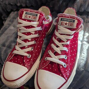 Converse Chuck Taylor All Star Ox low-top sneakers in red with white polka dots.